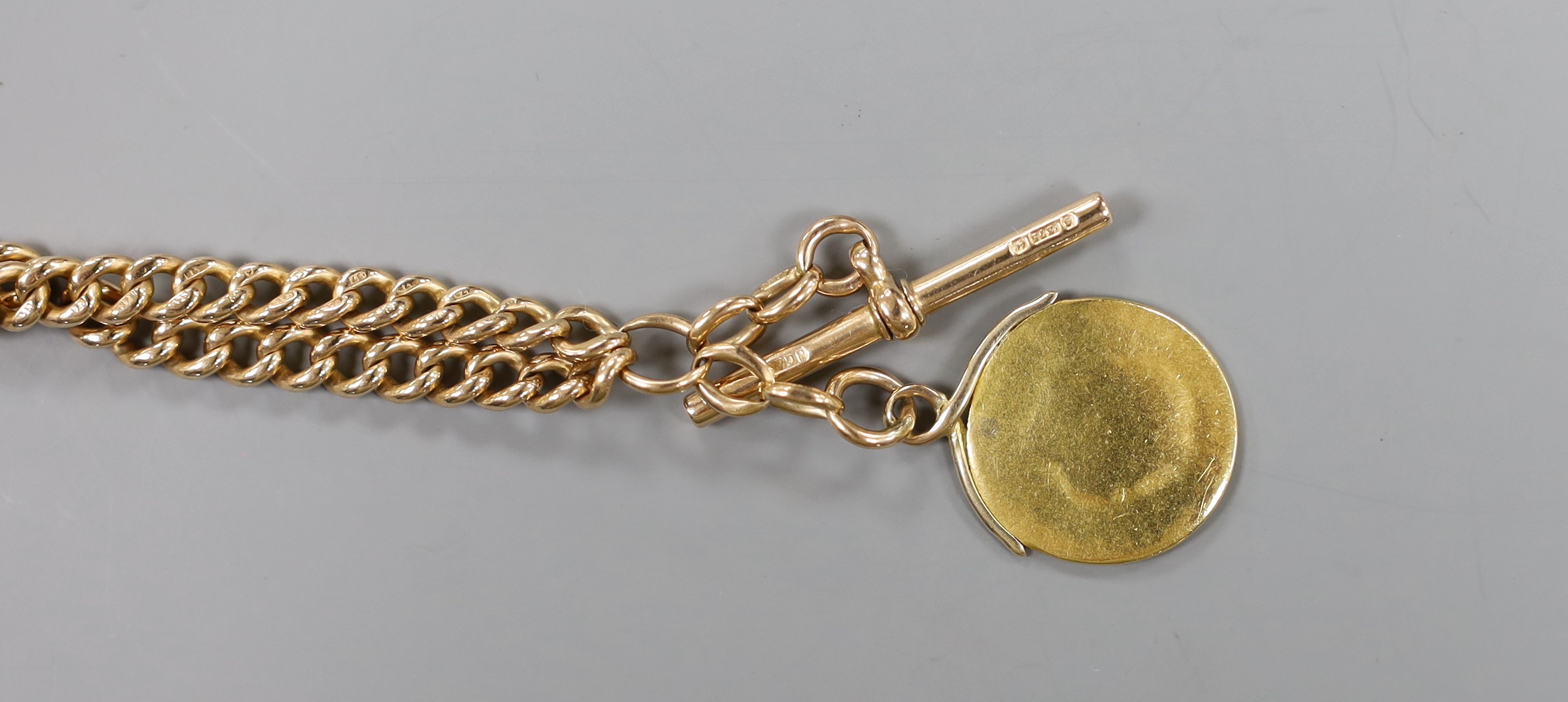 An early 20th century 9ct gold albert, 50cm, hung with a very worn sovereign, gross weight 49.6 grams.